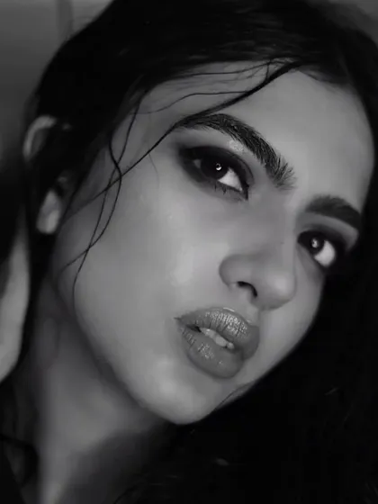 Another intense close-up of Kashika. The focus here is on the eyes, framed by bold brows and a deep, smokey shadow, demonstrating my skill in creating powerful, expressive eye makeup.