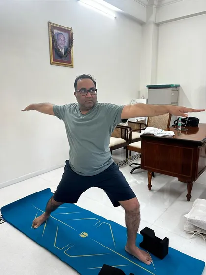 Virabhadrasana II (Warrior II). This pose opens the hips and strengthens the legs, and we focus on proper alignment to protect the knees and ankles.