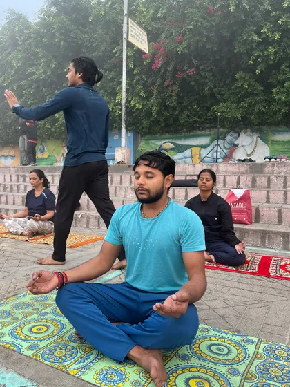 A student in deep meditation while I guide the class through a morning flow in Haridwar.