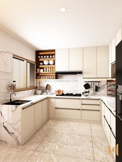 Another angle of the U-shaped luxury kitchen, highlighting the open spice rack and the seamless finish of the countertops.