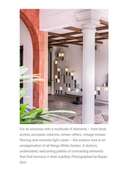 The entryway is a fusion of elements: brick arches, European columns, vintage mosaic flooring, and an installation of concrete light cubes. It’s an understated yet welcoming palette that sets a sophisticated tone.
