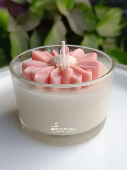 A close-up of the pink flower jar candle.