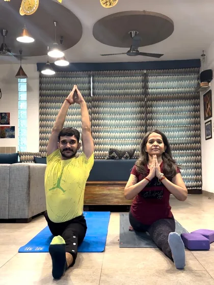 Teaching Hanumanasana (Monkey Pose) side-by-side. This shows how I demonstrate the pose while also being present for my student's practice.