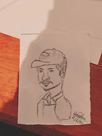 A third shot of the barista sketch. Capturing the logo on the cap is a fun little detail.