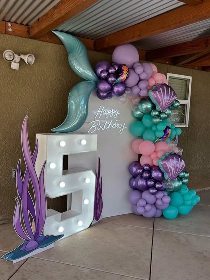 A side view of the mermaid party setup, showing how the decor transforms an outdoor patio space.