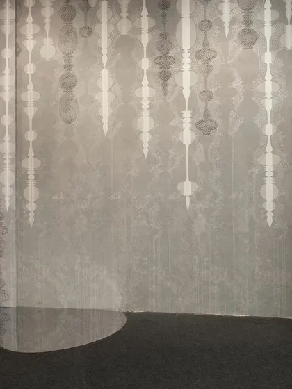 The 'AION' wallpaper and a sculptural paper totem from the 'Silver Escapade' installation. The theme explores the blurring of time through a mix of futuristic and historical design elements.