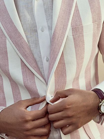 This jacket is the ultimate statement piece for any summer occasion, combining a playful color with a classic design.