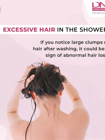 Finding large clumps of hair in the shower is a clear sign of abnormal hair loss. It's important not to ignore this, as it indicates that your hair may be weakening at the roots and requires professional attention.
