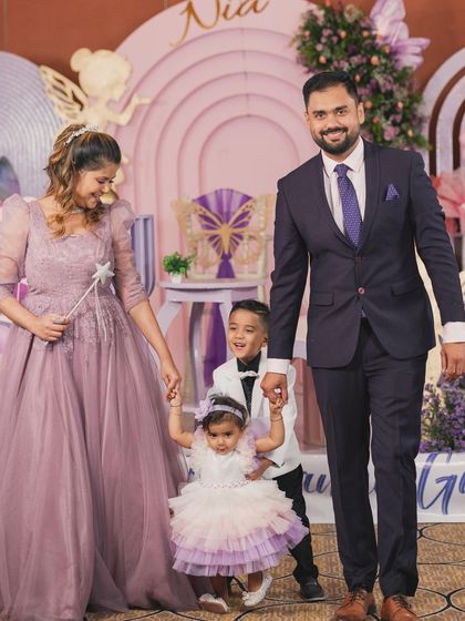 The beautiful family of fairy Nia, walking hand-in-hand at her enchanted garden party.