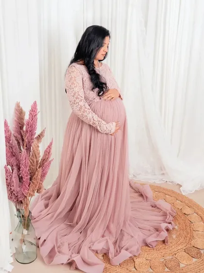 Simple, elegant, and minimal. This maternity portrait captures the quiet beauty and anticipation of motherhood against a clean, bright backdrop.