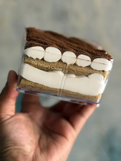 A side view of the 300gms Tiramisu tub, showing the beautiful layers of mascarpone cream and coffee-soaked ladyfingers.
