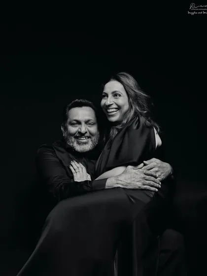 Milestones aren't just for kids. This black and white portrait captures the deep connection and laughter of a couple, proving that love is timeless at any age.