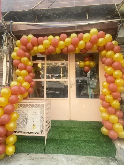 This is a classic balloon arch I designed for a new shop opening in Delhi. The bright yellow and orange colors are chosen to grab attention and create a festive atmosphere for the launch day.