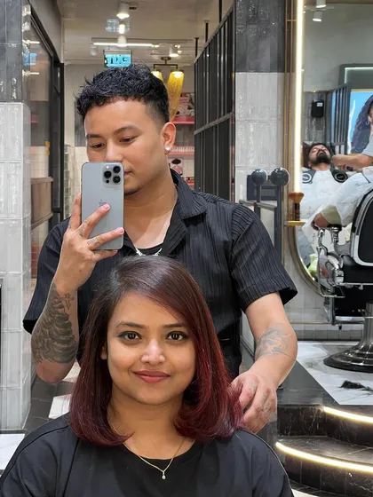 Everything feels better after a fresh hair color. This client is rocking a new red bob, looking confident and happy.
