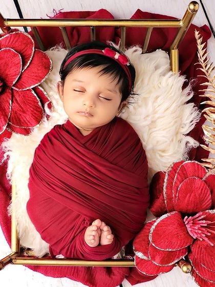 A full view of the elegant red and gold bed setup.