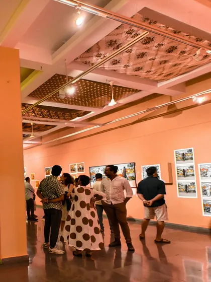 Visitors interacting and viewing artworks during the opening of 'No Longer A Memory', highlighting the social and communal aspect of the exhibition.