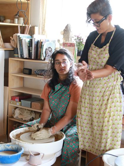 A moment of mentorship, as I stand by a student at the wheel, offering guidance and support as she learns.