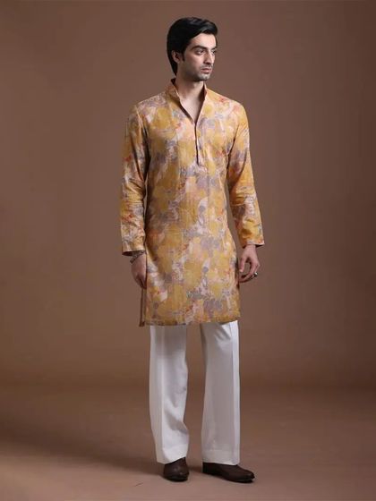A yellow printed kurta that offers a sophisticated yet celebratory look. It's an ideal choice for occasions that call for a blend of cultural richness and modern design.