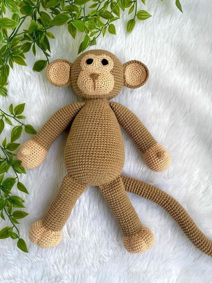 A playful monkey with a long tail, perfect for swinging around. This is my own custom design, and he's ready for lots of jungle adventures.