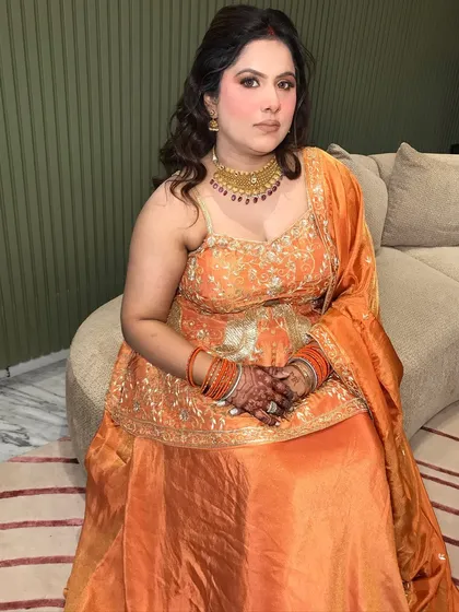 A relaxed pose, showing the full outfit and how the jewelry completes it.