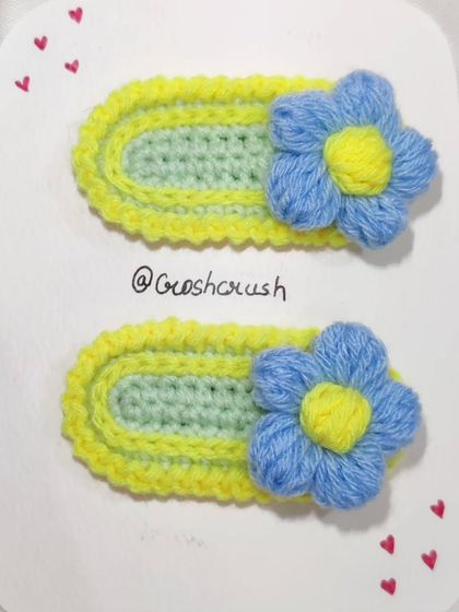 Korean-style flower hairclips with a two-tone design of light green, yellow, and blue.