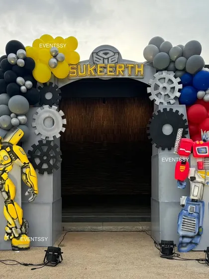 The grand entrance to the Transformers party, flanked by life-sized statues of Bumblebee and Optimus Prime.