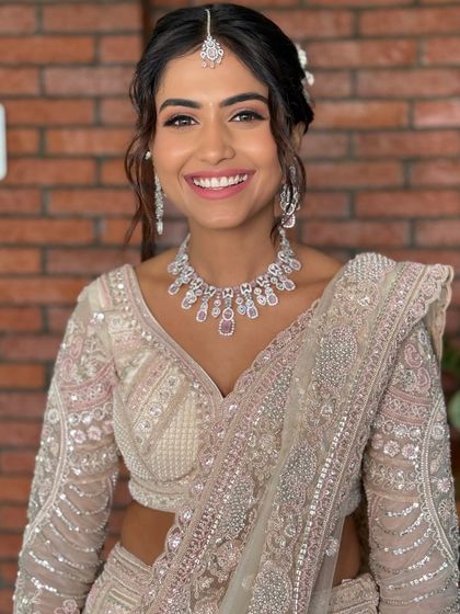 All things glow, grace, and glamour. This reception look features soft eyes, radiant skin, and a showstopper vibe.