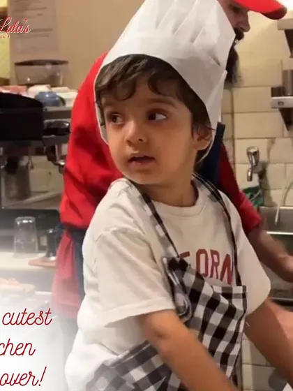 The cutest kitchen takeover. This little one, all geared up in his apron, is ready to learn the secrets of pizza making.