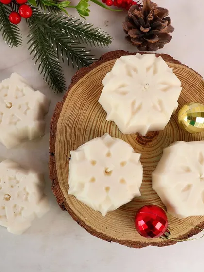Our snowflake candle is the perfect winter combination. It's a beautiful, intricate piece for your Christmas decor.