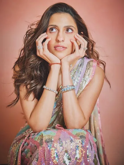 A playful and dreamy shot in the Manish Malhotra sequin saree, perfect for capturing those happy, celebratory moments.