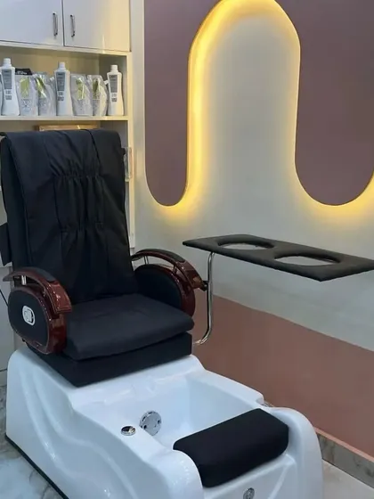 Your comfort is our priority. This is one of our dedicated pedicure stations, featuring a plush, comfortable spa chair and an integrated foot spa to ensure you can fully relax while we pamper your feet.