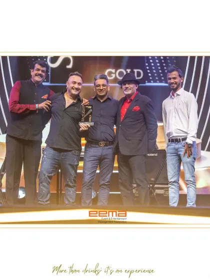 Our team on stage accepting the Gold award at the EEMA Spotlight Awards. This recognition from the event and entertainment industry is a testament to our innovative bar services and our impact on live events.