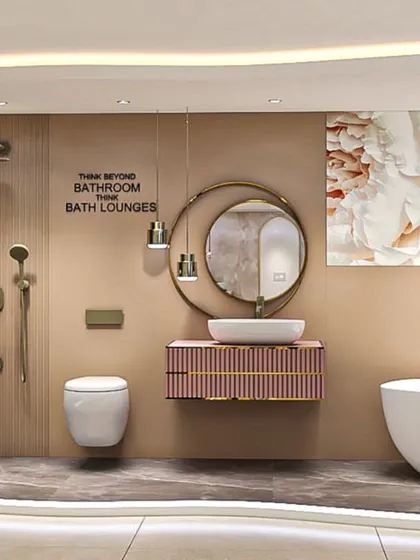 We believe in thinking beyond the bathroom to create 'Bath Lounges'. This space showcases a spa-like experience at home, featuring a freestanding tub, a floating vanity, and artistic wall decor, all tied together with soft, ambient lighting.