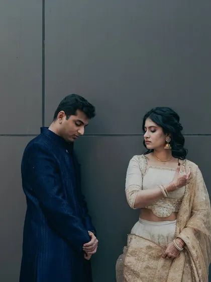 A modern and artistic shot from an engagement shoot. Her makeup is kept minimal and elegant, allowing the couple's connection to be the main focus.