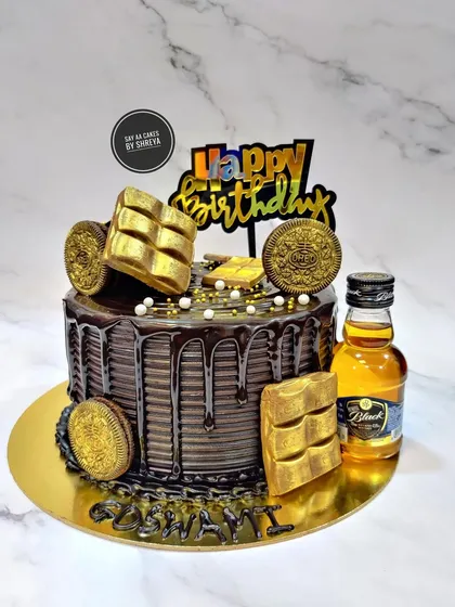 For the ultimate indulgence, I create custom birthday cakes like this double chocolate coffee cake. It features a rich chocolate drip, golden Oreo coins, and can be paired with a miniature bottle of your favorite spirit to elevate the celebration.