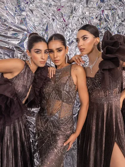 A group shot from the Kalki Fashion campaign, showcasing a range of modern, metallic gowns. This demonstrates my ability to create a cohesive theme for a group while highlighting individual styles.