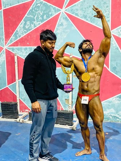 Celebrating a win with my brother and teammate. We push each other to be the best. This is the victory pose after a successful competition.