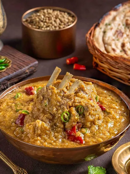 Mutton Dalcha, a hearty lentil and meat curry. The image for The Mughal House captures the rustic texture and spicy look of the dish, perfect for a comforting meal.