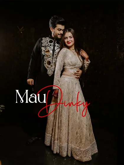 A classic, full-length portrait of the couple in their glamorous Sangeet outfits.