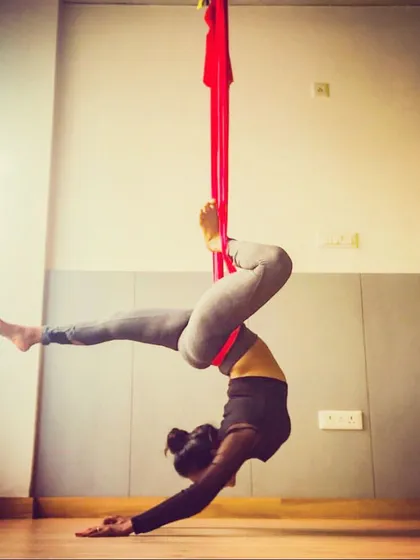 This is the kind of strength and grace you can build with consistent practice. The hammock acts as your partner, supporting you as you challenge your limits and discover what your body is truly capable of. This inverted pose is fantastic for building core and upper body strength.