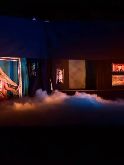 A similar atmospheric shot, where lighting and fog transform the stage into a dreamlike space, enhancing the poetic quality of Kalidasa's play.