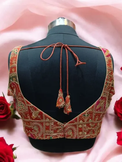 The back of a blouse is just as important as the front. This design features a deep, elegant back with tie-up tassels, ensuring you look stylish from every angle.