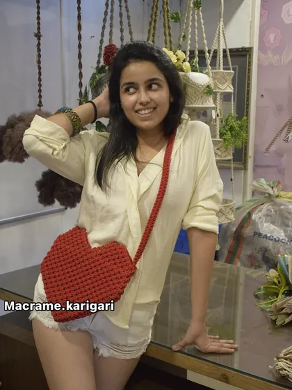 This heart-shaped macramé bag is a piece we’re incredibly proud of. It’s a bold, fun statement accessory that’s perfect for anyone who loves unique, handcrafted fashion. We make each one with sturdy cord, ensuring it’s as durable as it is lovely.
