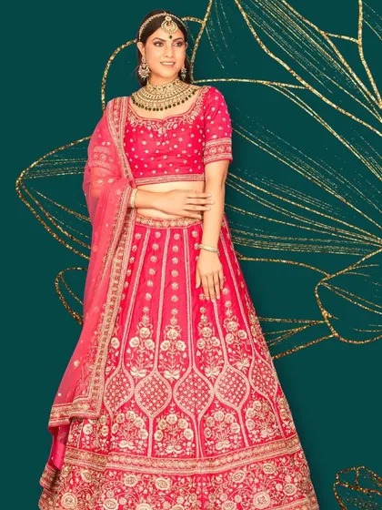 A dreamy pink bridal lehenga with exquisite silver embroidery. This piece is perfect for the bride who wants a traditional silhouette with a soft, romantic color palette.