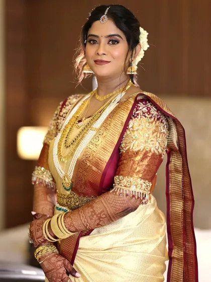 A classic bridal portrait. The makeup enhances her features beautifully, creating a look of timeless grace.