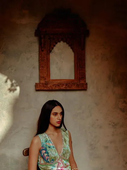 A soft, naturally lit portrait for Ruhr India, selected by PhotoVogue. The play of light and shadow across the wall adds texture and depth to this serene fashion shot.