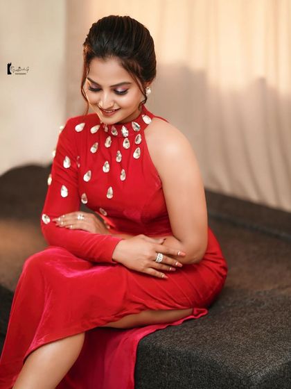 A soft and smiling portrait of Thanvi. This shows that a glamorous look can also be warm and approachable.