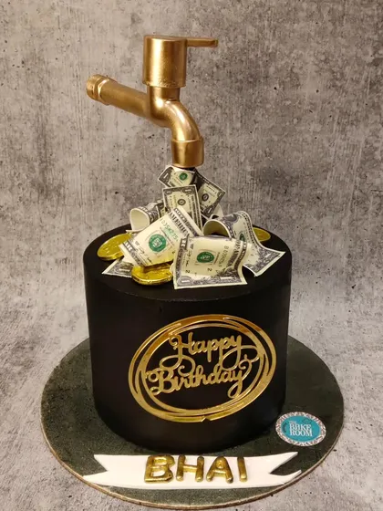 A cake that visualizes success and prosperity. This design features a golden tap from which edible money appears to flow, making it a fun and symbolic cake for a birthday.