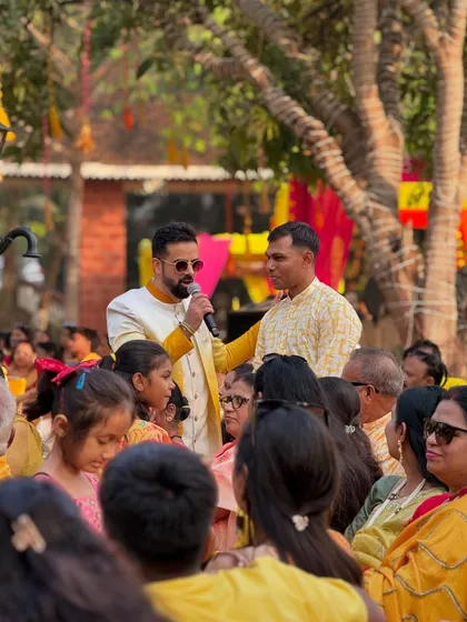 Engaging with family members during the Haldi ceremony. These personal interactions make the event feel more like a family gathering than a formal function.