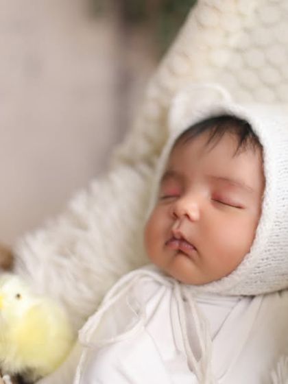 A close-up on a tiny, perfect face. Sometimes the simplest shots are the most powerful, capturing the pure and innocent expression of a sleeping newborn.